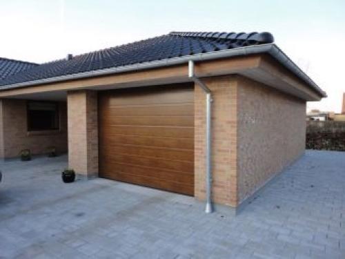 Секционные гаражные ворота с торсионными пружинами. Конструкция секционных ворот 02