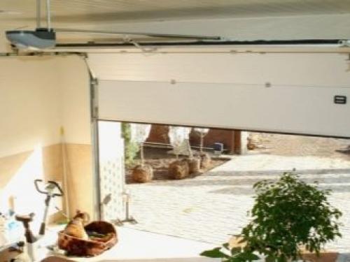 Секционные гаражные ворота с торсионными пружинами. Конструкция секционных ворот 06